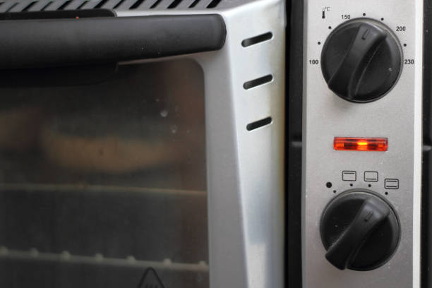 istock Toasting bread rolls in electric oven 1060144804