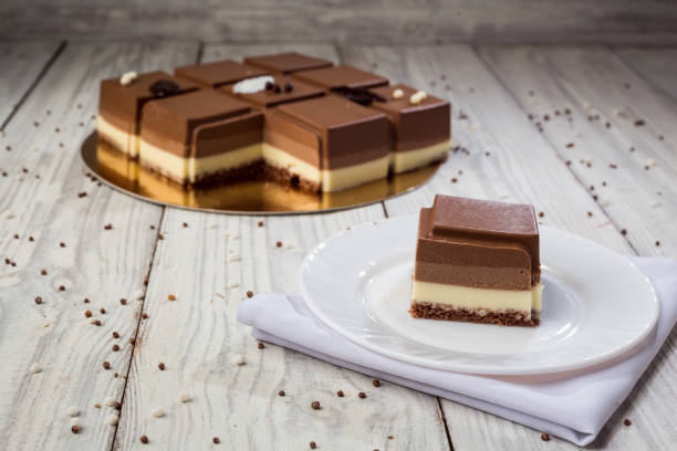 istock Dark chocolate vegan cake with candies on wooden background 1060145314