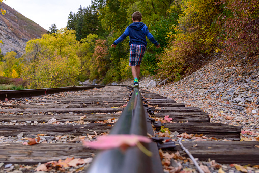I captured this view of my son as he was balancing on the railroad track outside of Vivian Park in Provo Canyon.  Beautiful autumn leaves all around including one resting right on the rail in front of him.