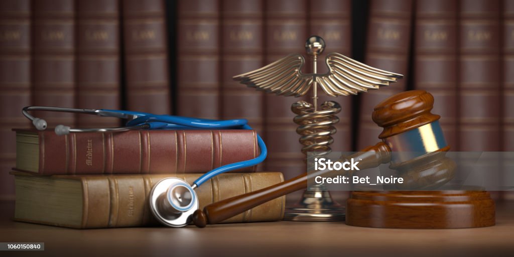 Gavel, stethoscope and caduceus sign on books background. Mediicine laws and legal, medical jurisprudence. Gavel, stethoscope and caduceus sign on books background. Mediicine laws and legal, medical jurisprudence. 3d illustration Healthcare And Medicine Stock Photo