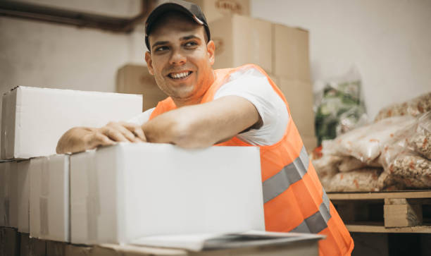 istock Man packaging boxes for an online store 1060156386