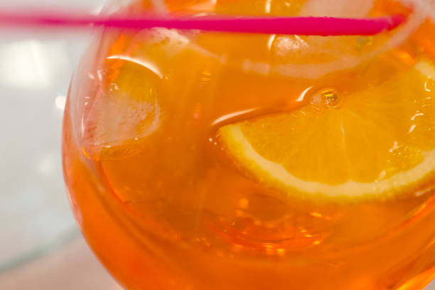 Spritz Cocktail with orange slices. Italian cocktail with aperitif, ice and orange, selective focus.