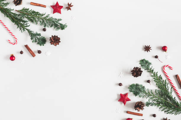 istock Christmas composition. Christmas decorations, fir tree branches,. pine cones on pastel gray background. Flat lay, top view, copy space 1060167890