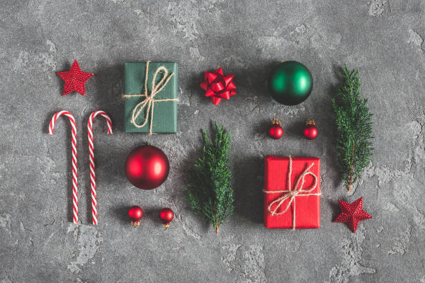 istock Christmas composition. Gifts, fir tree branches, red decorations on black background. Christmas, winter, new year concept. Flat lay, top view, copy space 1060169556