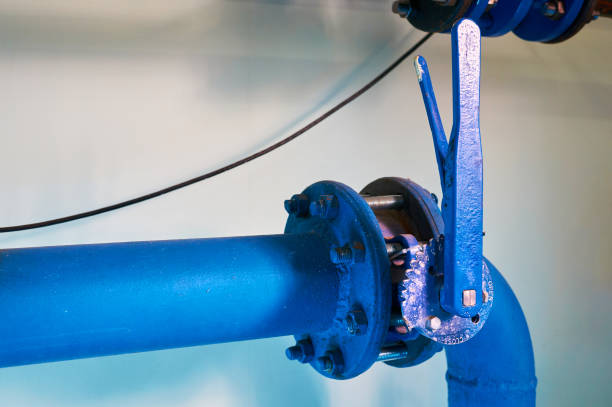 istock Valves installed on tubes painted blue. Industrial background. 1060172690