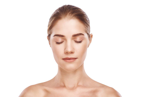 istock Beautiful woman face close-up studio on white 1060178612