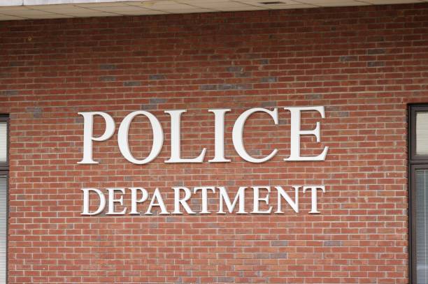 Police Department Police department sign on brick wall close up police station stock pictures, royalty-free photos & images