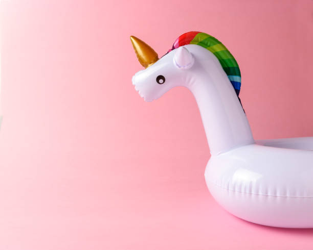 istock Inflatable unicorn pool toy on pink background. Minimal summer c 1060193688