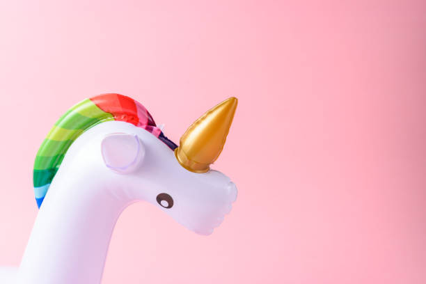 istock Inflatable unicorn pool toy on pink background. Minimal summer c 1060193692