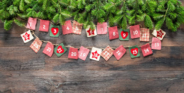 istock Christmas tree branches Advent calendar wooden background 1060196604