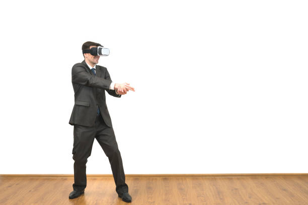istock The man in a virtual reality glasses gesturing on a white wall background 1060200798