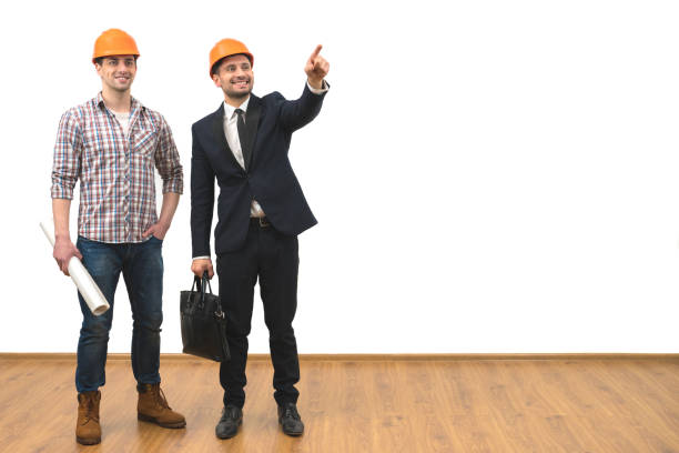 istock The two engineers gesture on the white wall background 1060201300