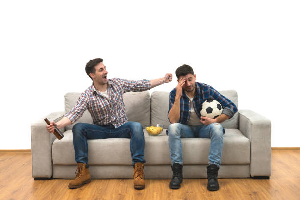 istock The two men with a beer handshake on the sofa on the white background 1060203964