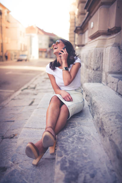 istock Young woman talking on mobile phone 1060207218