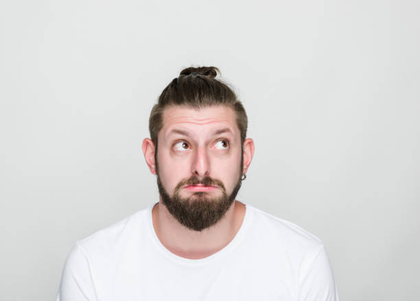 istock Portrait of thoughtful young men over white background 1060211292