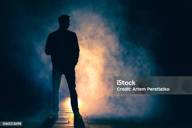 The Man Standing In The Fog Evening Night Time Stock Photo - Download Image Now - Men, In Silhouette, Spy