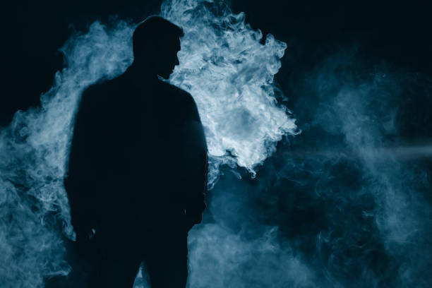 silhouette überlebender im rauch. abend nacht - raum eine person dunkelheit stehen gegenlicht stock-fotos und bilder
