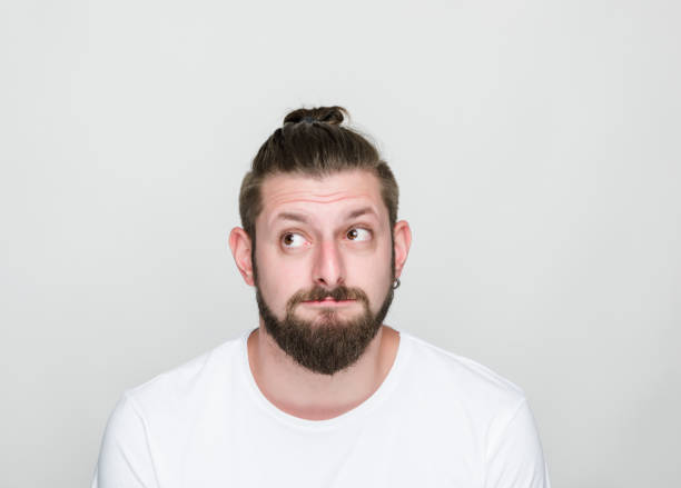istock Portrait of thoughtful young men over white background 1060214156