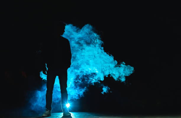 istock The man standing in the smoke. evening night time 1060214188