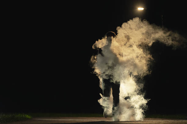 istock The man walking in the smoke on the dark background 1060214190