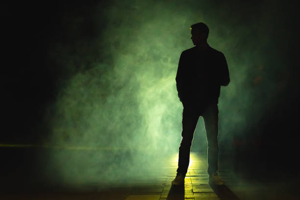 istock The man standing in the fog. evening night time 1060214192