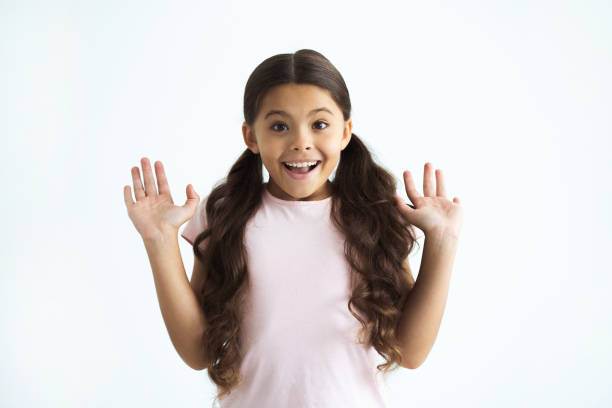 istock The happy girl gesturing on the white background 1060214602