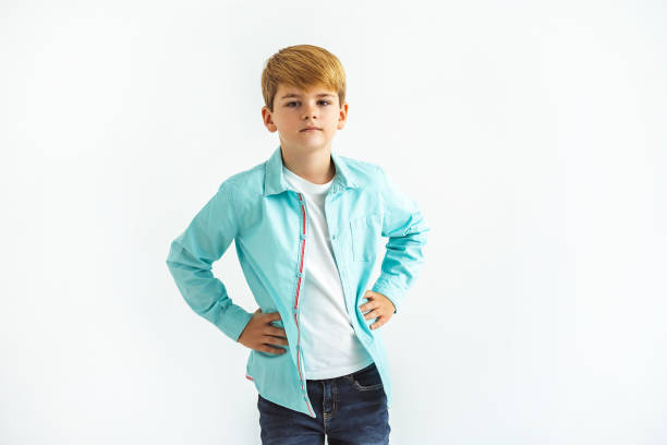 istock The little boy standing on the white background 1060216018