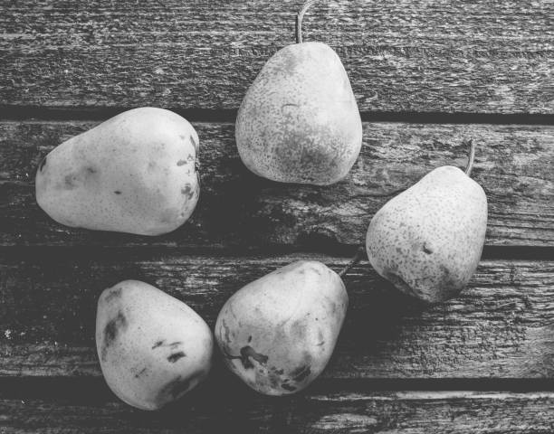 Many pears on a rustic wooden table. Useful fruit. Healthy diet food. Top view.