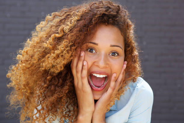 istock Close up young woman with surprised face expression 1060224666