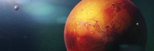 istock red planet Mars with moons Phobos and Deimos, member of the solar system 1060224822