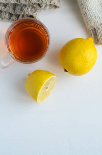 istock cup of tea , one and half lemon and woolen sweater. 1060227744