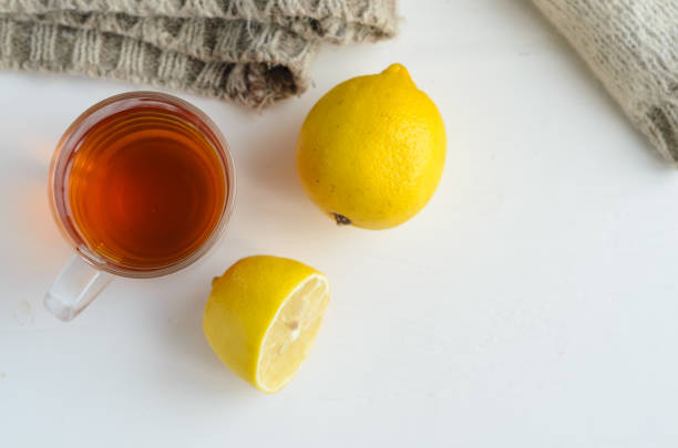 istock cup of tea , one and half lemon and woolen sweater. 1060227764