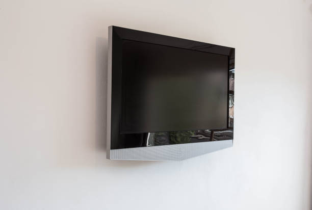 istock Black LED tv television screen mockup mock up, blank on white wall background 1060240334