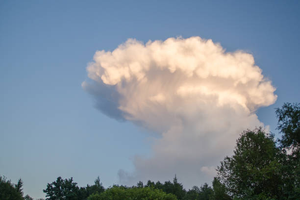 istock Clouds light sun summer storm sky blue mushroom 1060241938