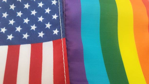 istock United States flag and Rainbow Pride Flag (LGBT) together close up 1060242542