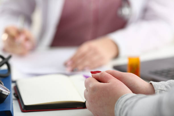istock Female doctor hand hold silver pen 1060242670