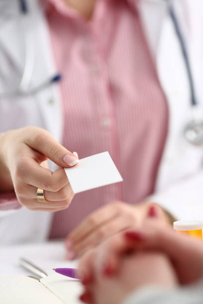 istock Female physician hand give white blank 1060242702