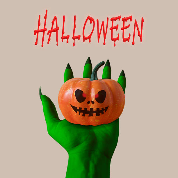 istock Zombie's green hand with Pumpkin. Halloween minimal concept. 1060247368
