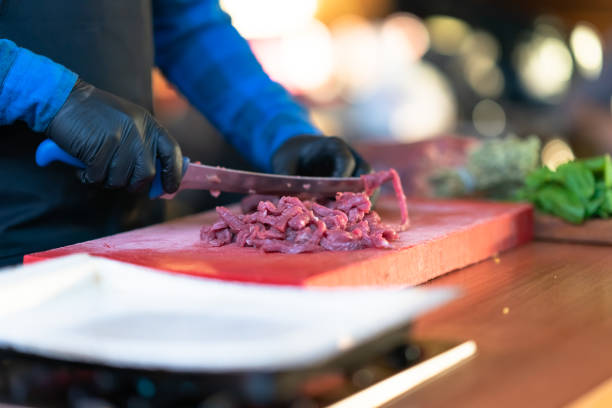 istock Professional chef is chopping the meat. 1060256424