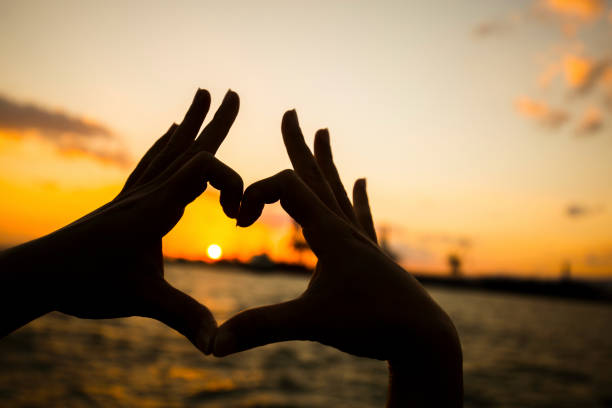 istock Hand Heart and Sunset 1060260240