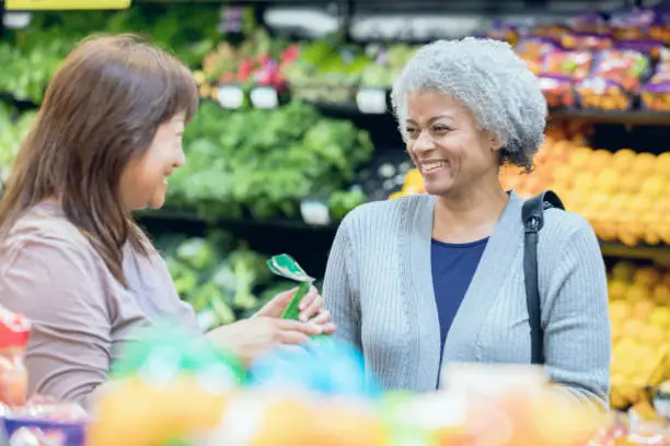 Vector illustration of Diverse senior women shopping in grocery store or supermarket