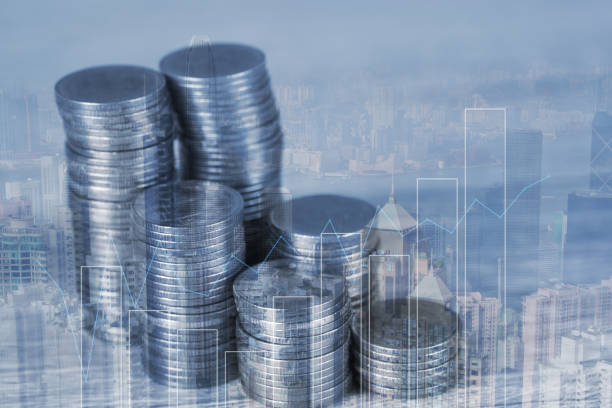 istock Double exposure Stack of coin with financial graph over city and office building background, business and financial concept. 1060280584
