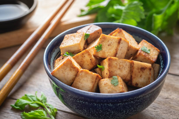 istock Fried tofu in bowl, Vegetarian food 1060287836