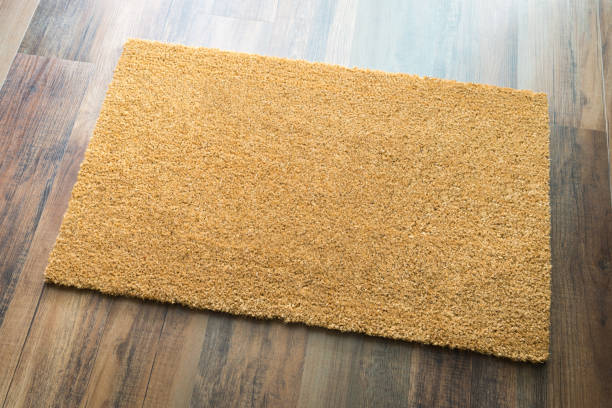 istock Blank Welcome Mat On Wood Floor Background Ready For Your Own Text 1060295988