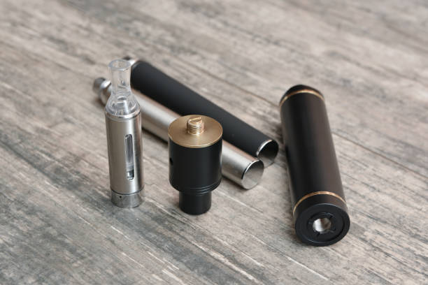 istock E - cigarette for vaping , technical devices.The liquid in the bottle 1060317344