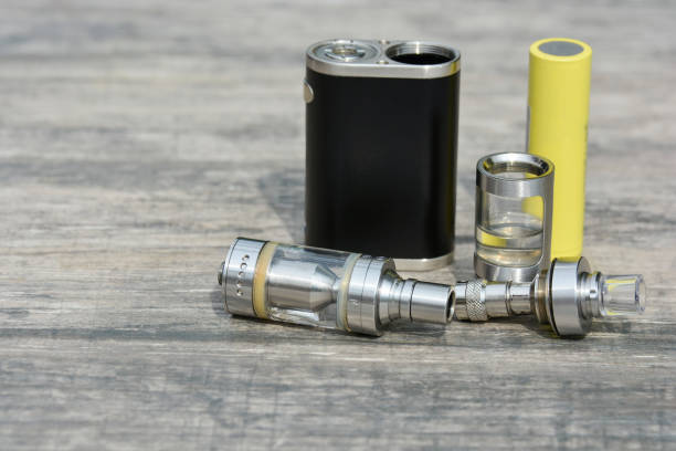 istock E - cigarette for vaping , technical devices.The liquid in the bottle 1060317466