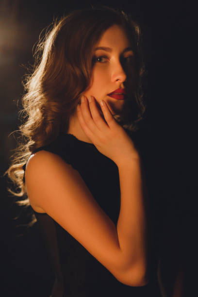 istock Seductive young woman posing on a black isolated background 1060331408