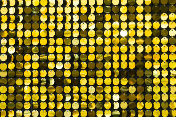 istock Background sequin. sequin BACKGROUND. glitter surfactant. Holiday abstract glitter background with blinking lights. Fabric sequins in bright colors. Fashion fabric glitter, sequins 1060337116