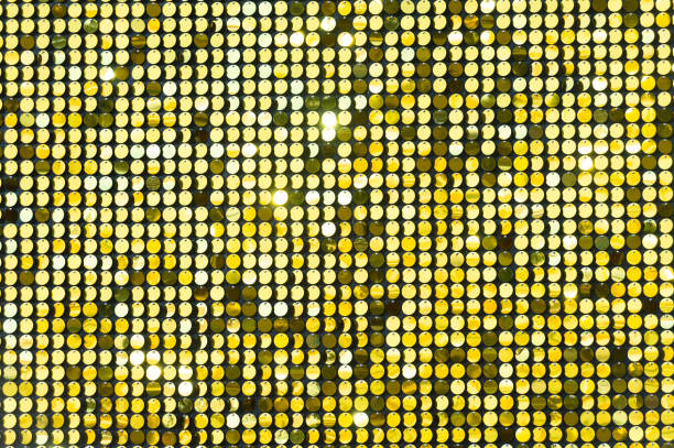 istock Background sequin. sequin BACKGROUND. glitter surfactant. Holiday abstract glitter background with blinking lights. Fabric sequins in bright colors. Fashion fabric glitter, sequins 1060337126