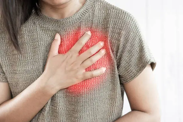 Photo of Asian woman having heart attack